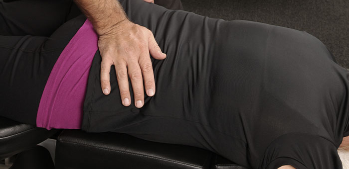 patient receiving flexion distraction technique in Campbell for auto accident injury